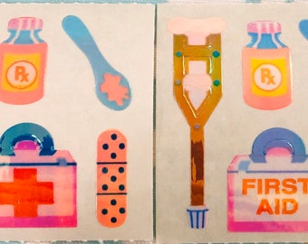 May include: A set of eight colorful stickers featuring medical supplies, including crutches, a first aid kit, bandages, and a bottle of medicine. The stickers are perfect for adding a fun and whimsical touch to any project.