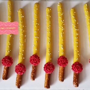 Beauty Belle Chocolate covered pretzel sticks. Red rose pretzel rods for a Belle party