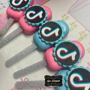 Tiktok inspired cakesicles. Tiktok cakesicles. Tiktok cakepops. Tiktok party favors. Tiktok cookies.