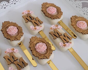 Rose cakesicles.  Rose flower cookies. Rose cakepops. Babyshower Rice Krispies. Babyshower invitation. Rose flower invitations