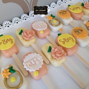 Lemon squeeze cakesicles. Lemon cakesicles. Lemon squeeze bridalshower cakesicles. Lemon squeeze bridal shower