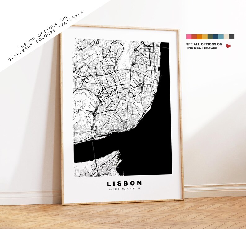 May include: A black and white map print of Lisbon, Portugal. The map shows the city's streets and coastline. The city name "Lisbon" is printed in white at the bottom of the map.