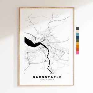 May include: A black and white line art map of Barnstaple, England. The map shows the city's streets, rivers, and other features. The city's name and coordinates are printed below the map.