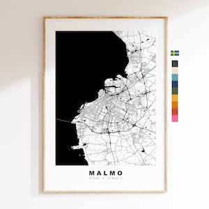 May include: Black and white city map print of Malmo, Sweden. The map shows the city's streets and waterways. The print is framed in a light wood frame.