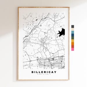 May include: Framed black and white map print of Billericay, with the town's name in a bold, sans-serif font at the bottom. The map features roads, buildings, and geographical details. The frame is a light wood color.