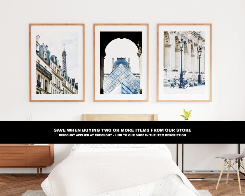 May include: Three framed photographs of Parisian architecture. The first image shows a street lined with buildings and a tall tower in the distance. The second image shows a view of the Louvre Pyramid through an archway. The third image shows a row of columns with a bicycle parked in front.