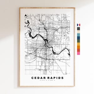 May include: Black and white map print of Cedar Rapids, Iowa. The map shows the city's streets and waterways. The city name is printed at the bottom of the map.