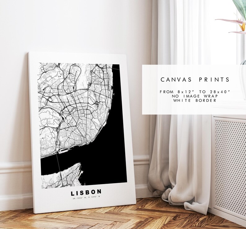 May include: Black and white map print of Lisbon, Portugal. The map is framed and hanging on a white wall. The text "CANVAS PRINTS" is visible in the image. The text "FROM 8 x 12" TO 28 x 40" NO IMAGE WRAP WHITE BORDER" is also visible in the image.