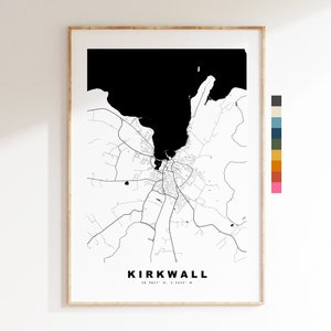 May include: Black and white map print of Kirkwall, Scotland. The map shows the city's streets and coastline. The text "KIRKWALL" and the coordinates "58.9847° N, 2.9422° W" are printed below the map.