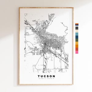 May include: Black and white line art map of Tucson, Arizona. The map shows the city's streets and major landmarks. The text "TUCSON" and the coordinates "32.2240° N, 110.9742° W" are printed below the map.