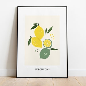 May include: A framed print with a minimalist illustration of lemons and limes in yellow, green, and white on a cream background. The text "LES CITRONS" is at the bottom of the print.