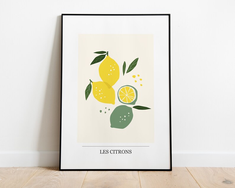 May include: A framed print with a minimalist illustration of lemons and limes in yellow, green, and white on a cream background. The text "LES CITRONS" is at the bottom of the print.