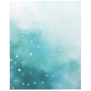 May include: A rectangular canvas print featuring an abstract watercolor design that transitions from a deep teal at the bottom to a pale white at the top. The surface is covered in small, scattered white paint splatters across the gradient.
