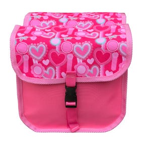 May include: A bright pink bicycle bag featuring a repeating pattern of hearts and circular flower motifs in shades of light pink, white, and cyan. The bag has a flap closure secured with a black plastic side-release buckle and pink trim.
