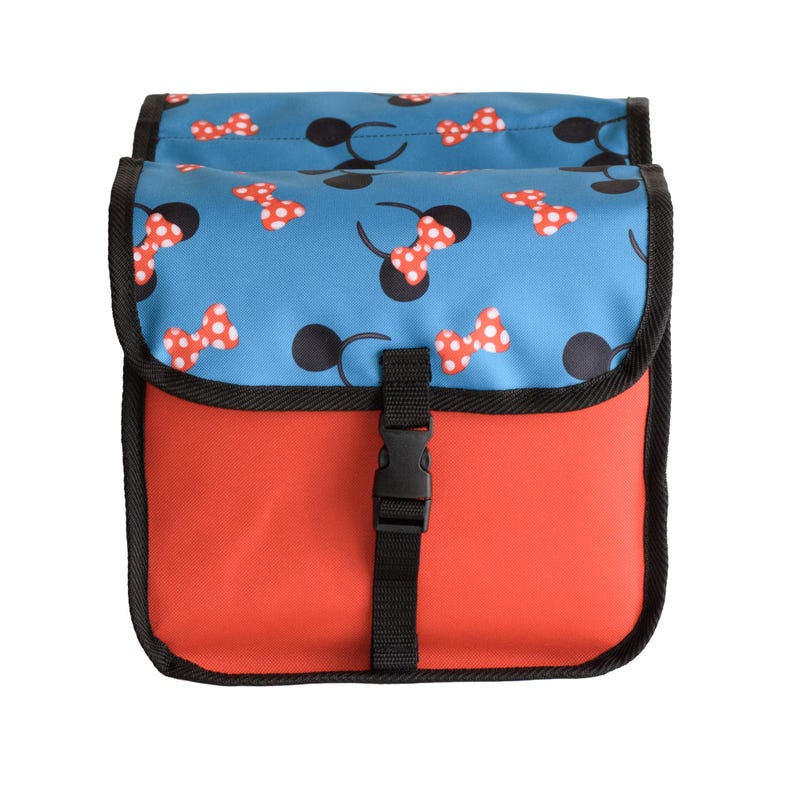 May include: A rectangular bag with a solid red lower section and a blue flap featuring a repeating pattern of black mouse ears and red polka-dot bows. The bag is secured with a black nylon strap and a plastic side-release buckle closure.