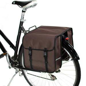 May include: A brown bicycle pannier bag with reflective accents attached to a black bicycle.