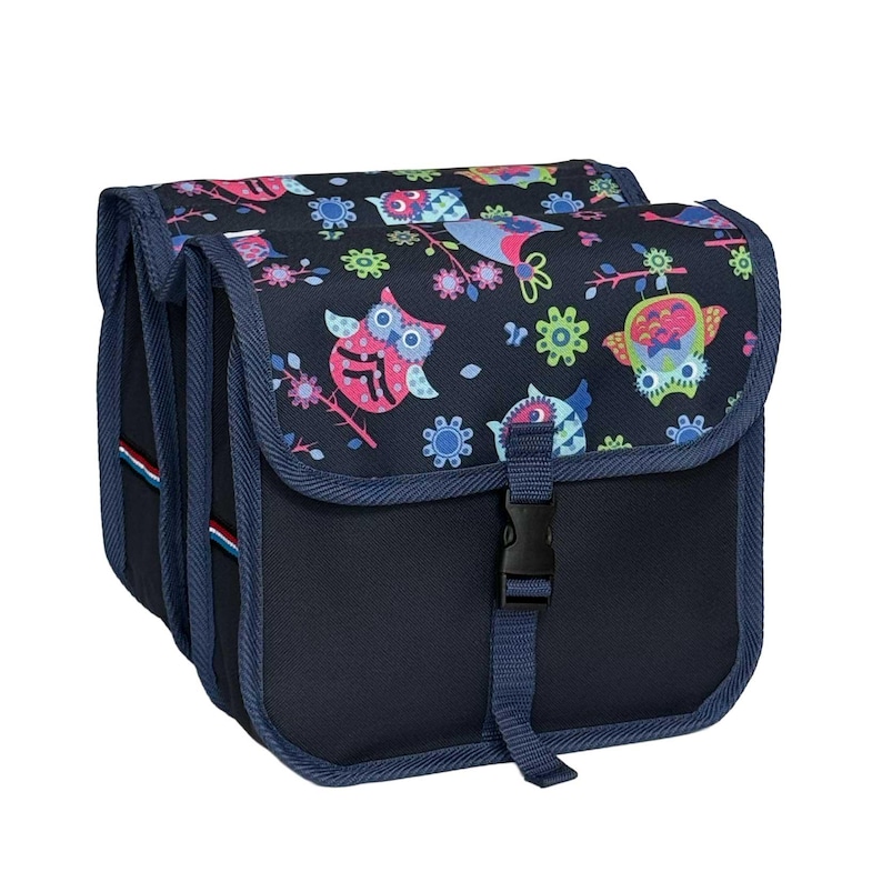 May include: A dark blue double bicycle pannier bag featuring a colourful pattern of owls and flowers on the top flaps. The bag includes adjustable straps with black plastic buckles for secure closure and reinforced blue fabric trim along the edges.