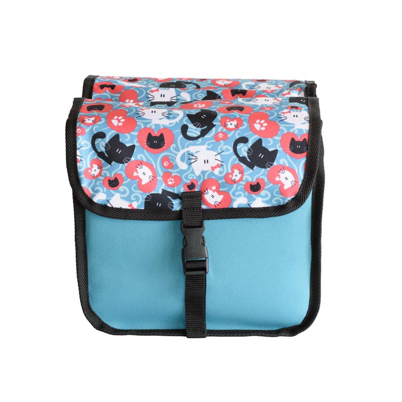 May include: A light blue bicycle pannier bag featuring a flap with a pattern of black and white cats, red hearts, and paw prints. The bag has black trim, a black adjustable strap, and a black plastic buckle closure centred on the front panel.