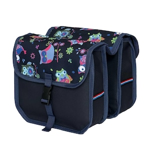 May include: A double bicycle pannier bag in dark navy blue featuring a colourful owl and floral pattern on the top flaps. The bag includes adjustable black plastic buckle closures, reinforced blue fabric trim, and small red, white, and blue accents.