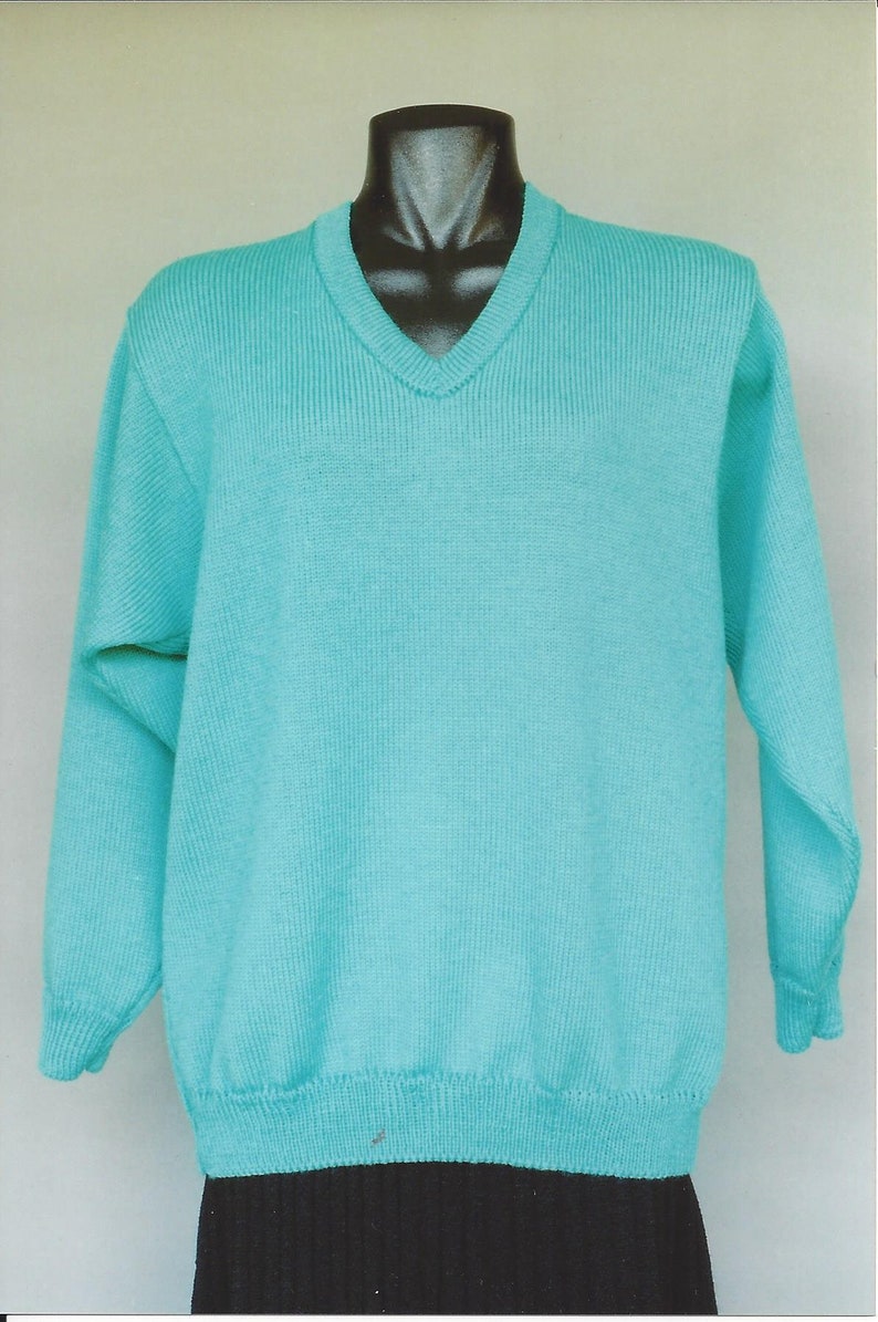 May include: A turquoise blue v-neck sweater with long sleeves.