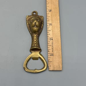 Apribottiglie in ottone a forma di testa di leone, vintage