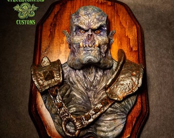 Orc 1/4 scale Hand painted resin relief mounted on a stained wood wall plaque.