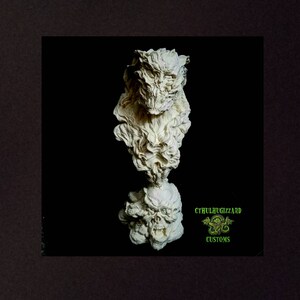 May include: A white ceramic sculpture of a monstrous creature with a skull-like face and a swirling, smoke-like body. The sculpture is on a black background and has the text "CTHULHUGIZZARD CUSTOMS" in green.