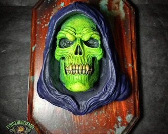 Skeletor 1/3rd  scale resin relief eyeless version  Hand painted mounted on a stained wood wall plaque