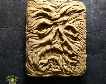 Necronomicon Book of the Dead 1/4 scale relief Magnet from Evil Dead   , unpainted resin casting.  measures approximately 2.5 inches tall .