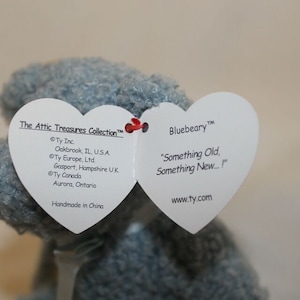 May include: Bluebeary the bear from the Attic Treasures Collection. The tag reads "Something Old, Something New..." and includes the Ty Inc. copyright information and website address.