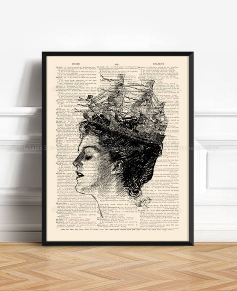 May include: Black and white illustration of a woman's face with a ship sailing out of her head. The image is printed on a vintage dictionary page with text from the dictionary visible around the illustration.