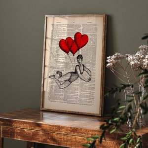 May include: A black and white illustration of a person flying with three red heart-shaped balloons against a vintage dictionary page background.