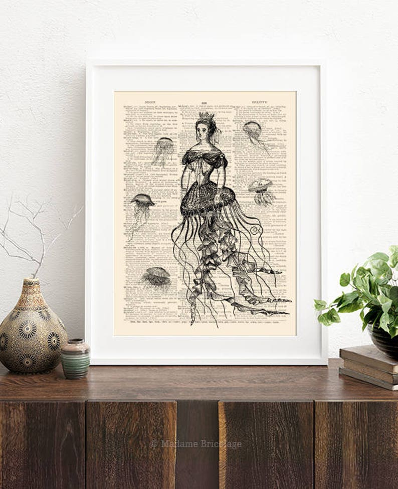 May include: A black and white illustration of a woman wearing a jellyfish dress. The dress is made of jellyfish tentacles and the woman is wearing a crown. The illustration is printed on a vintage book page.