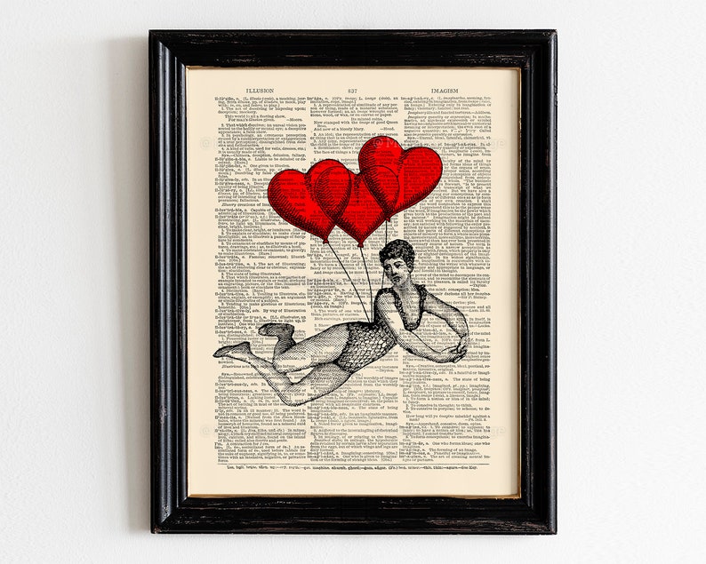 May include: A vintage dictionary page with a black and white illustration of a woman holding onto red heart-shaped balloons. The text on the page reads "ILLUSION" and "IMAGINATION".