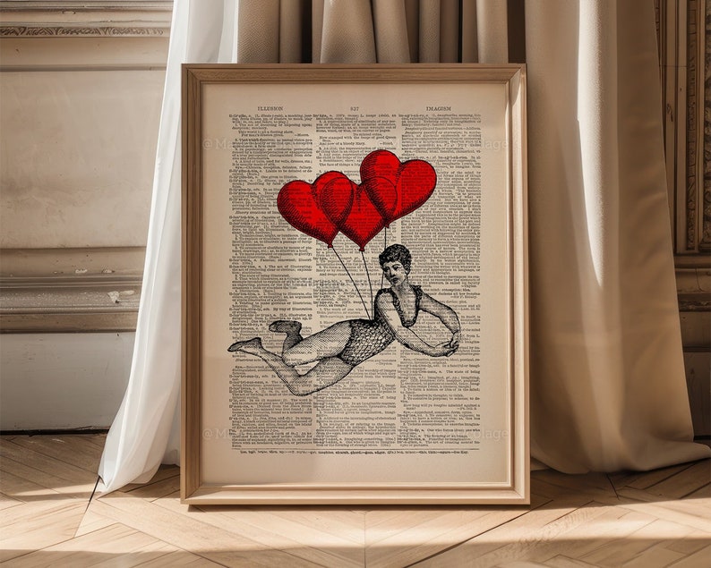 May include: A vintage dictionary page with a black and white illustration of a person holding onto three red heart-shaped balloons. The text on the page is in English.