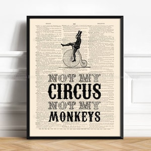 Puede incluir: Ilustración vintage en blanco y negro de un hombre montando una bicicleta de rueda alta. La imagen se superpone a una página de un diccionario antiguo. El texto "Not my circus, not my monkeys" está impreso debajo de la imagen.