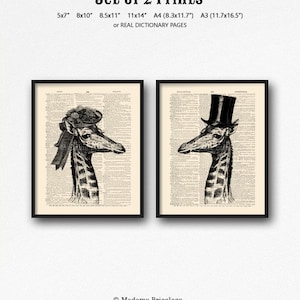 May include: Set of two black and white prints of a giraffe wearing a hat. The giraffe on the left is wearing a hat with a bow and the giraffe on the right is wearing a top hat. The prints are on a vintage dictionary page background.