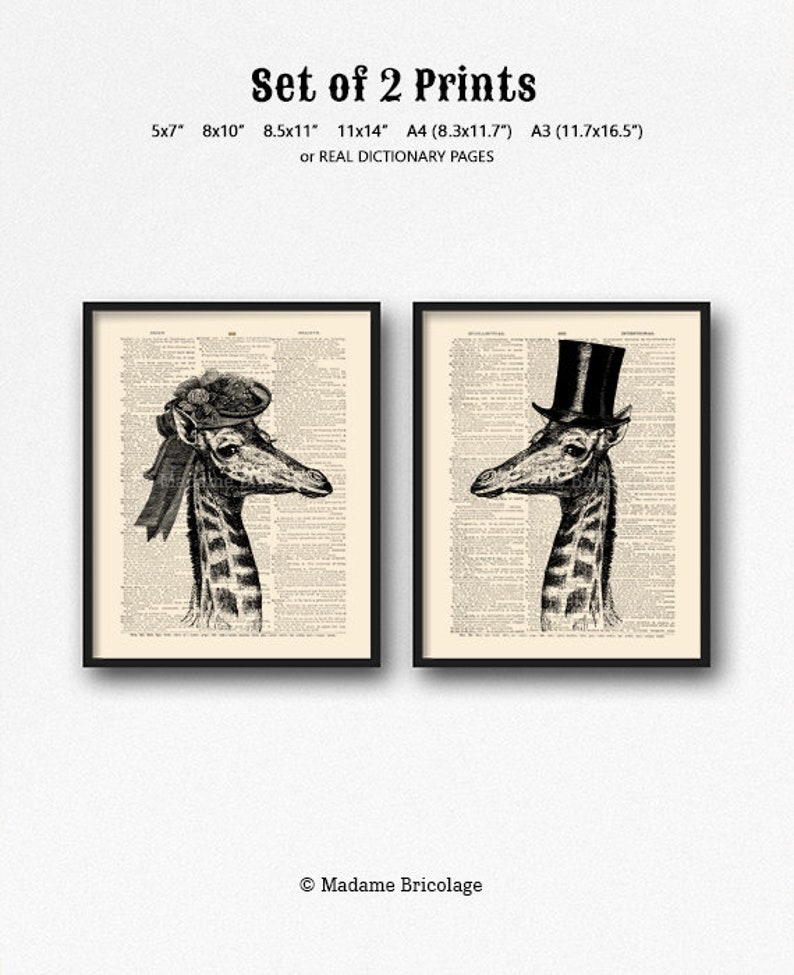 May include: Set of two black and white prints of a giraffe wearing a hat. The giraffe on the left is wearing a hat with a bow and the giraffe on the right is wearing a top hat. The prints are on a vintage dictionary page background.