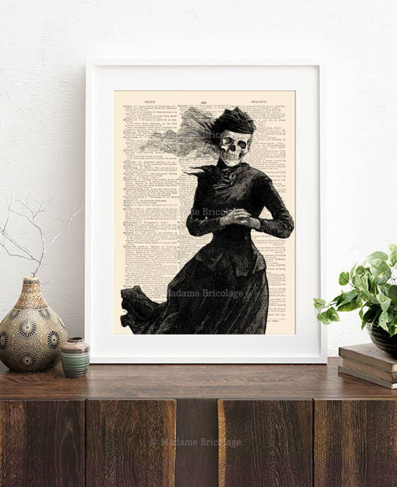 May include: A black and white illustration of a skeleton wearing a Victorian-era dress and hat. The image is printed on a vintage dictionary page with the text "Madame Bricolage" visible.