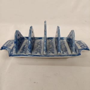 Antique blue and white transfer toastrack Decorated with castle keeps and gates Hackman