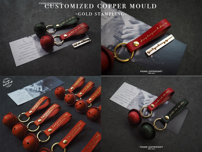 May include: A set of red leather keychains with gold-stamped lettering and a small bell charm. The keychains are arranged on a black surface. The text on the keychains reads "TATATATTOO".