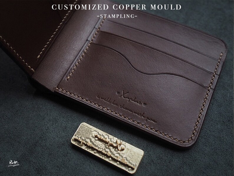May include: A brown leather wallet with multiple card slots and a stitched edge. The wallet has the text "Xaplaro" and "small is the new big" embossed on the front.