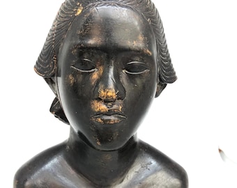 sculpture of lady in wood
