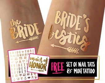 May include: Gold temporary tattoos for a bridal party. The tattoos say "the bride", "bride's besties", and "maid of honor". A free set of nail tattoos and a maid of honor tattoo are included.