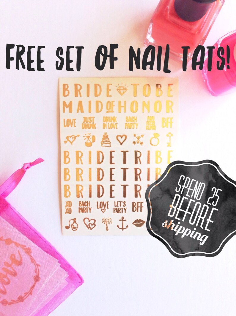 May include: A set of gold nail decals with various bridal-themed designs, including "Bride Tribe", "Maid of Honor", and "Just Drunk in Love". The decals are on a white background and come in a pink organza bag. The image also includes a black and white sticker that says "Spend $25 Before Shipping".