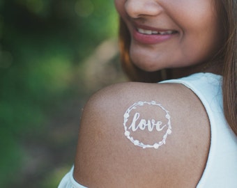 Single "LOVE" metallic gold foil temporary tattoo