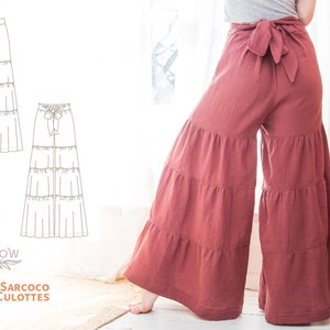 May include: A sewing pattern for a tiered culottes with a wide leg and a tie at the waist. The pattern is called "The Sarcoco Tiered Culottes" and is from the brand "Sewwillow Patterns to Sew + Knit".