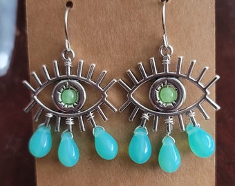 Crying eye earrings with uranium glass pupils and tears