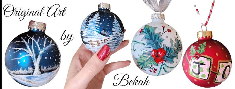 May include: Three hand-painted Christmas ornaments. One ornament is blue with a white tree and snowflakes. Another ornament is white with green holly and red berries. The third ornament is red with green holly and the letters "JOY" in white.
