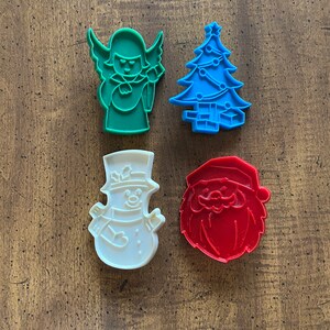 Set of 4 Yuletide Plastic Cookie Cutters Christmas Tree Snowman Angel Santa 1979